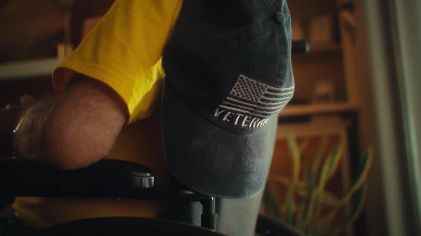 Cap on a wheelchair with a person sitting