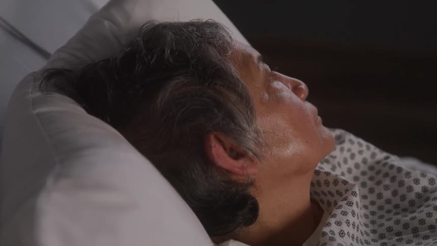 Lady patient lying in hospital bed