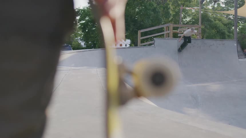 Teenagers are skateboarding on the ramps