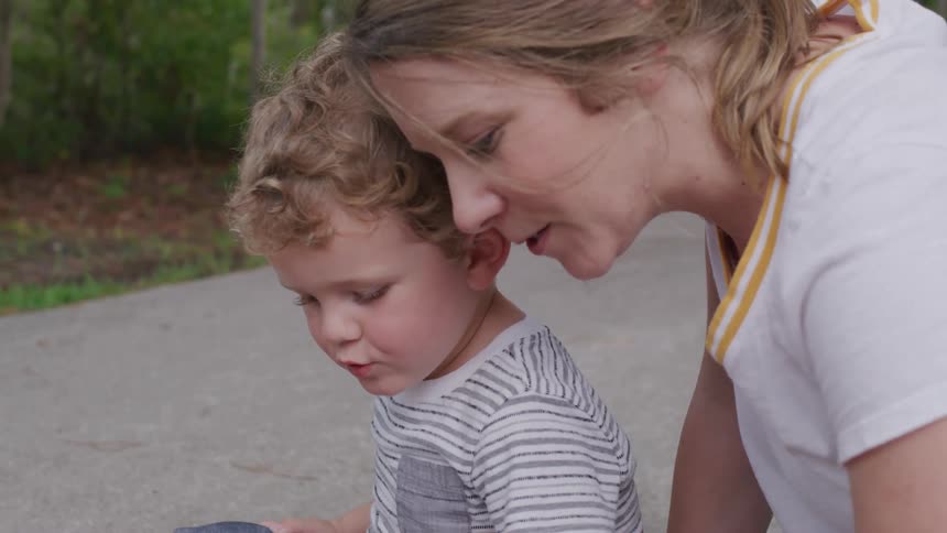 Mom and son share a happy moment together outdoors