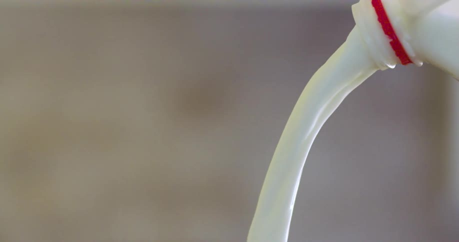 Milk is poured from a carton