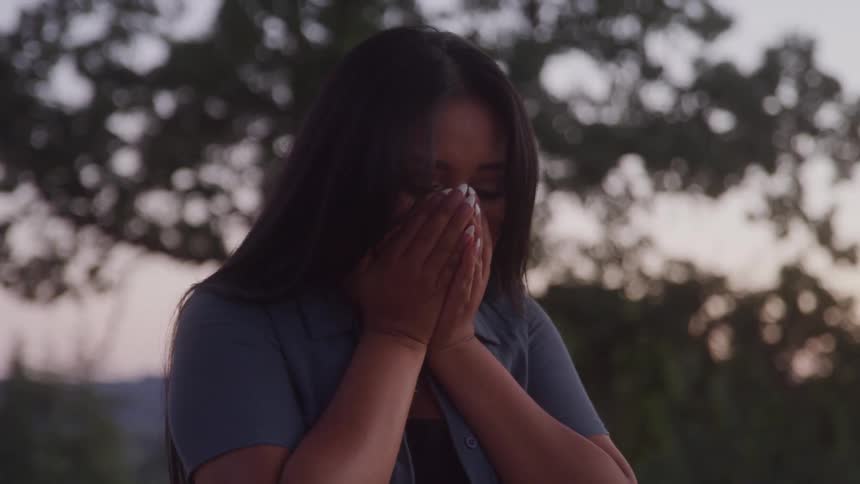 A woman getting emotional after receiving a marriage proposal