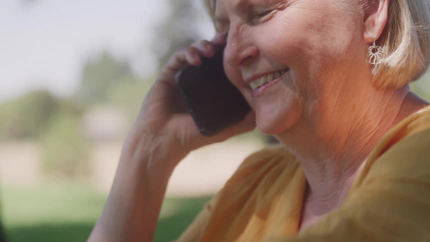 Woman on a cell phone call with happy expression