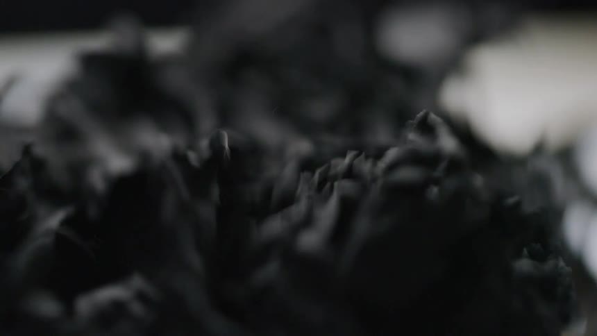 A black object vibrates