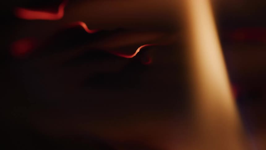 Flames and sparks in motion create an abstract effect of light and heat