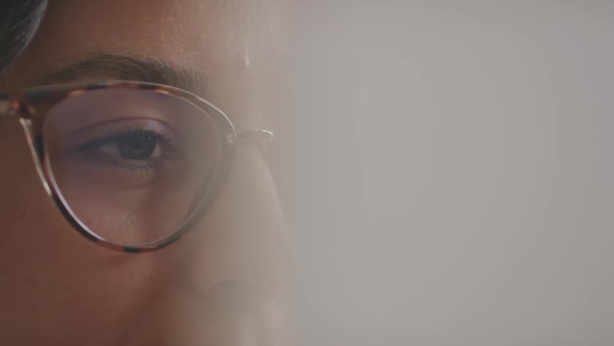 Portrait of a focused woman with glasses