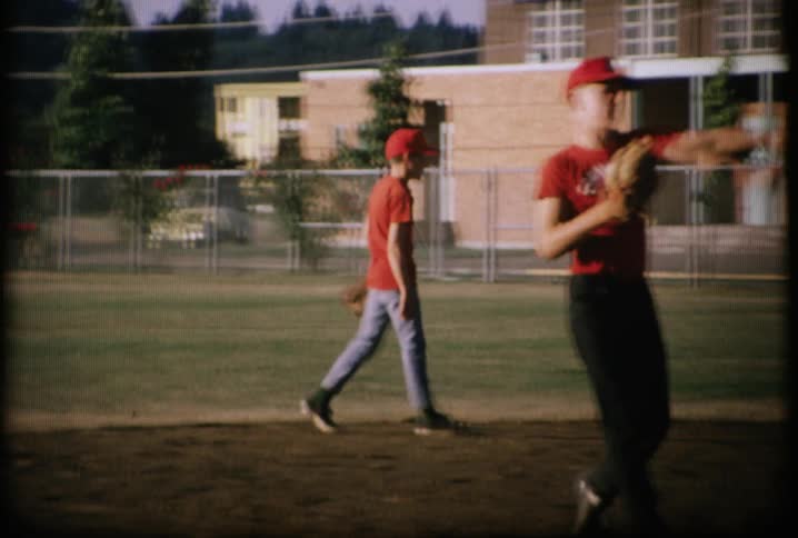 Players throw a ball around on the field