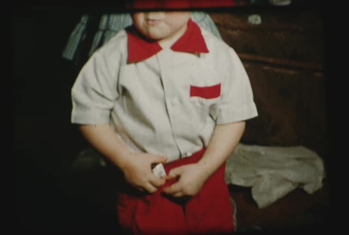 A boy puts something in his pocket
