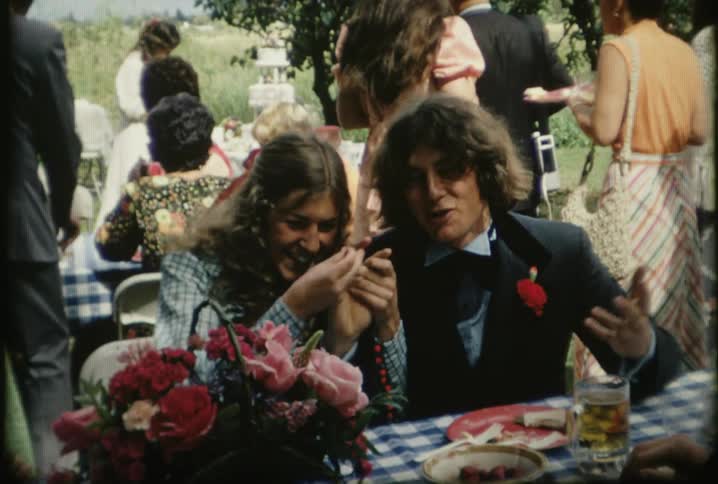 A man and woman play at a gathering