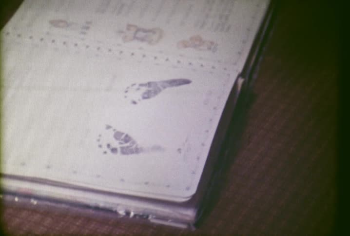 A baby book with ink footprints