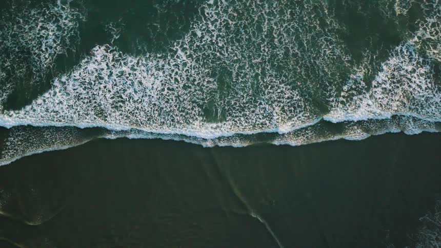 Waves wash up along the beach
