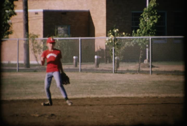 A player catches the baseball in the field