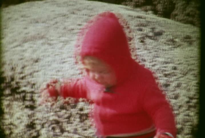 A child is laughing and playing in the water