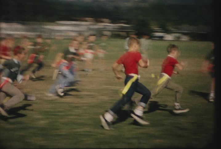 Boys playing flag football on a field