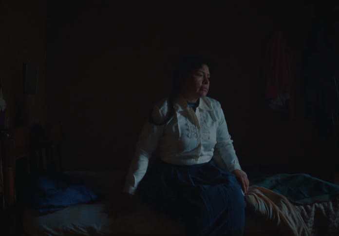 Woman waking up and getting out of bed