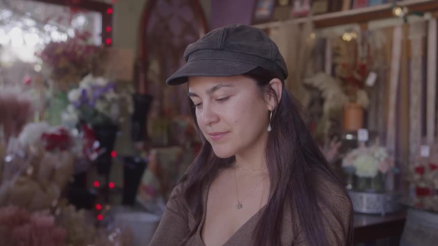 A customer is shopping in the flower shop