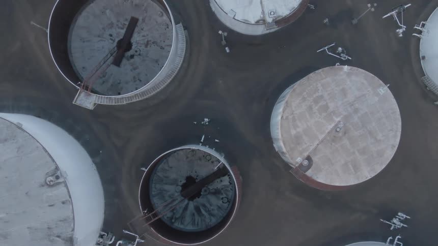 Storage silos fill the lot