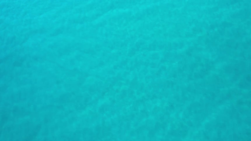 Aerial of beautiful torquoise waters in the ocean