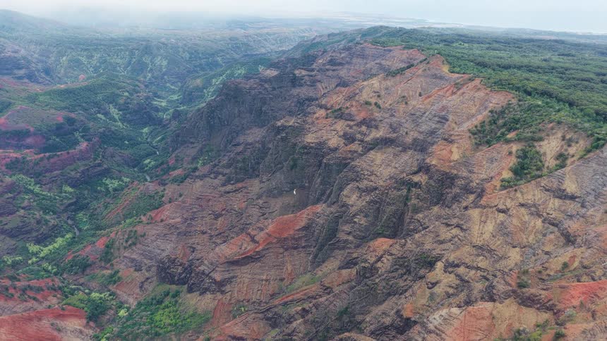 Aerial panorama of mountains and ruins in a vast lateral view