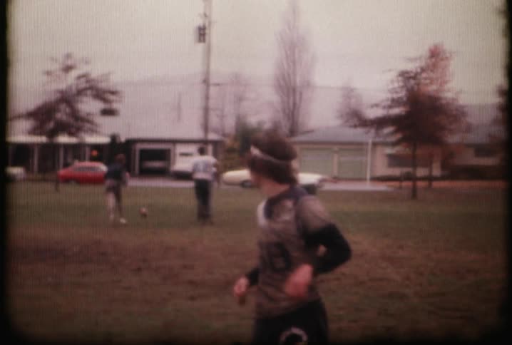 People are playing football throwing around a ball