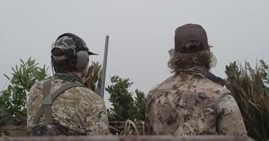 Two hunters are waiting together