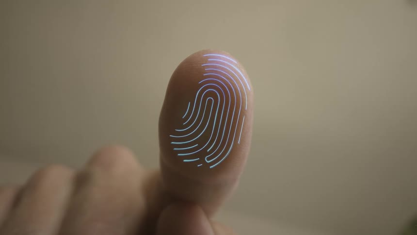 A person presses a finger against a screen which creates a trace of their fingerprint