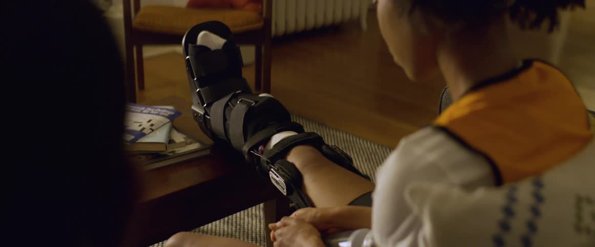 A child has a leg brace on her right leg