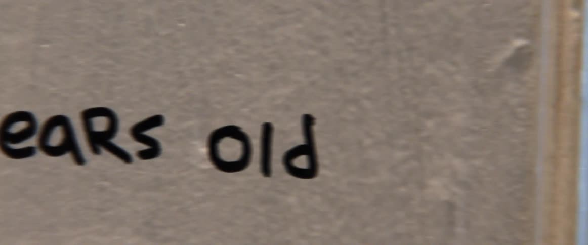 Handwritten text reads 18 years old on a beige background