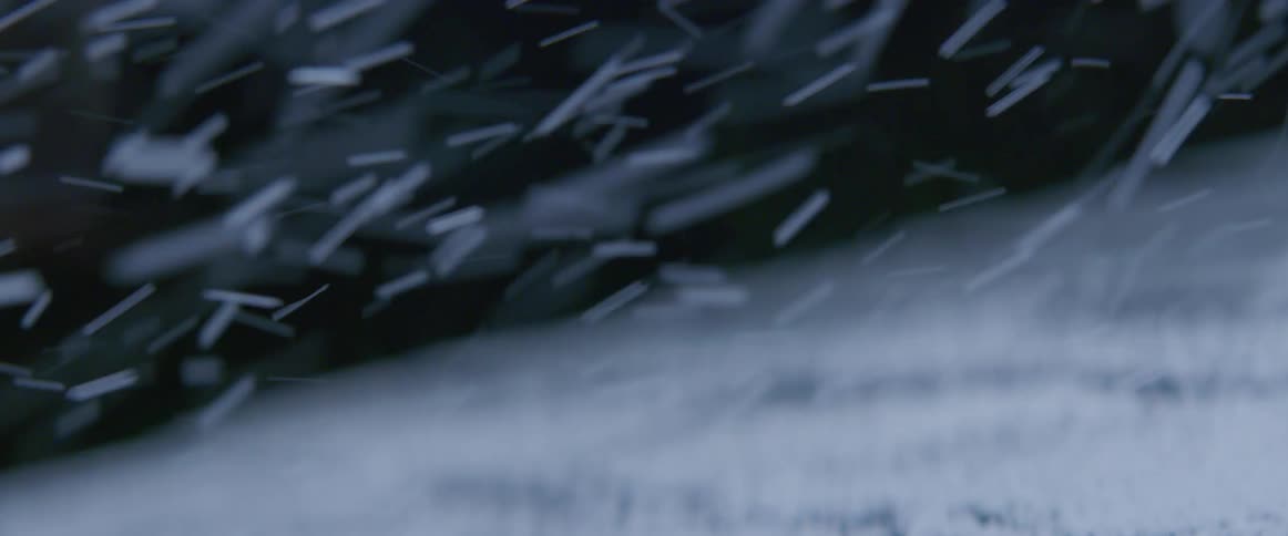 Layer of snow accumulating on a surface during a snowstorm