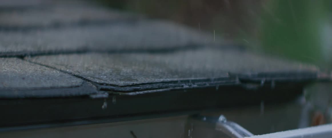 Rain falls on shingles