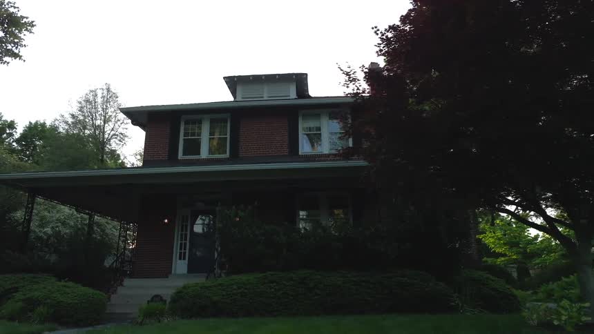 Trees surround the home