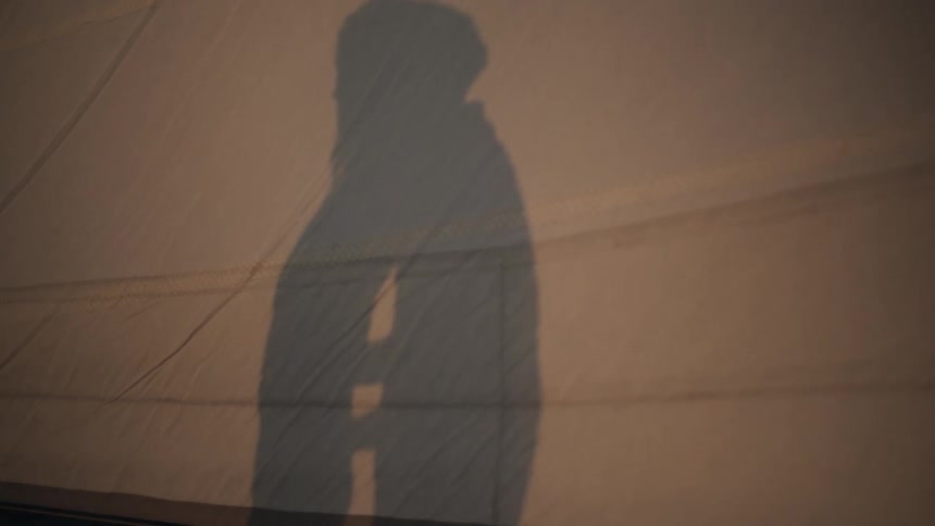 Shadow of a man and a woman facing each other
