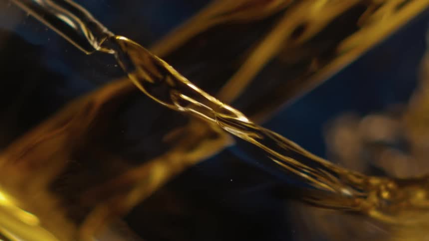 Liquid is being poured into a glass