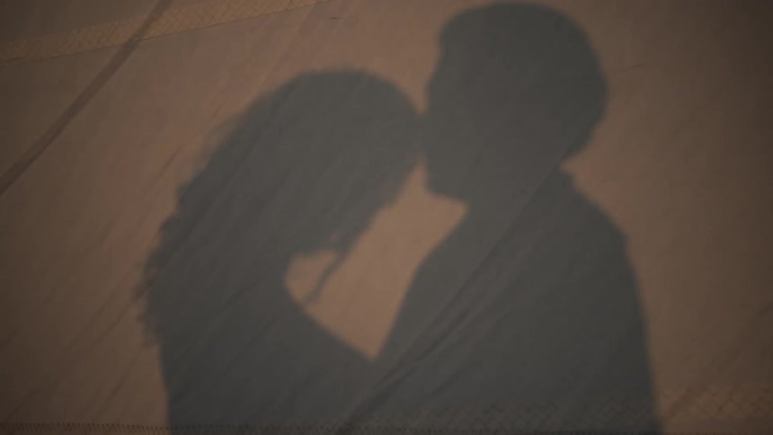 Reflected shadow of a couple in a tender moment