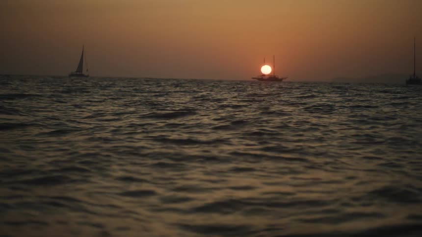 Sailboats on the sea during sunset