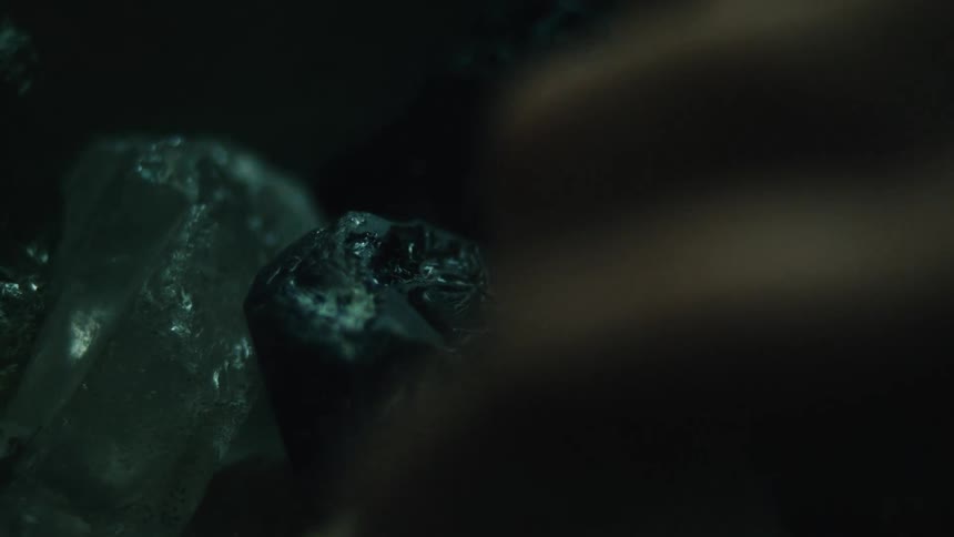 Hand of a person handling precious stones