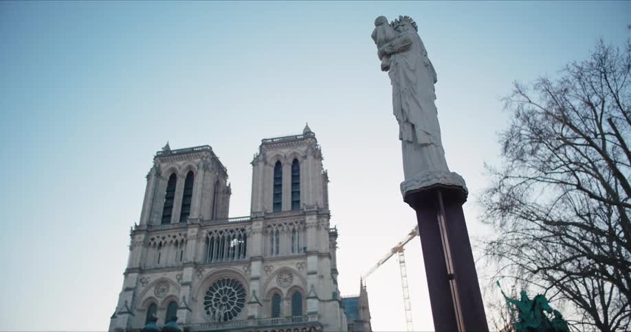 A statue in front of a cathedral