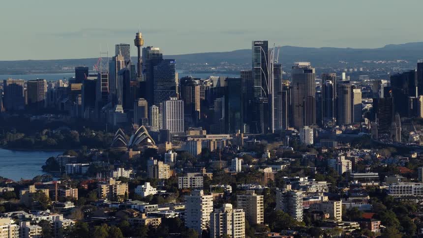 Aerial view of the city at midday with many buildings skyscrapers iconic landmarks and vibrant culture