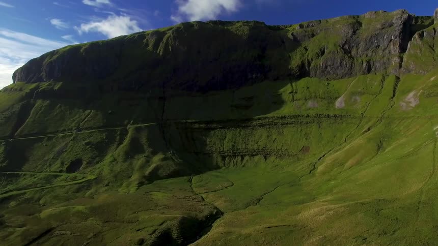 A green rock formation