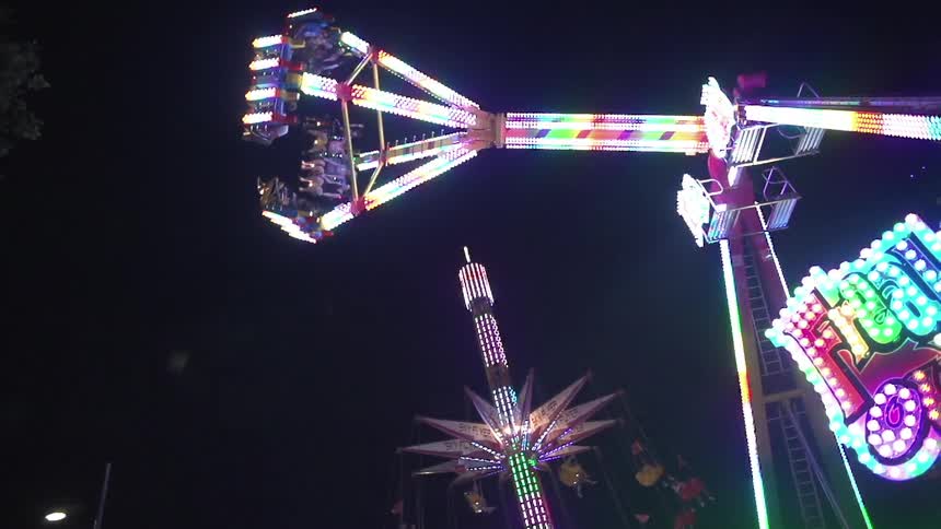 Carnival ride swinging at night