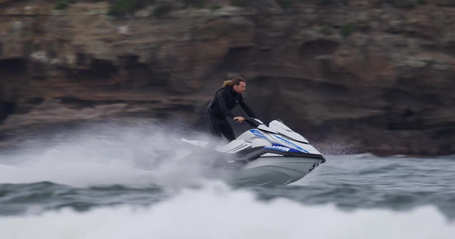 Man riding upright on a jet ski