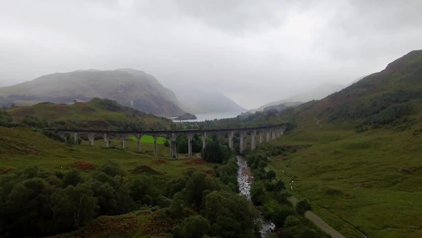 A bridge is lined ahead on this pasture