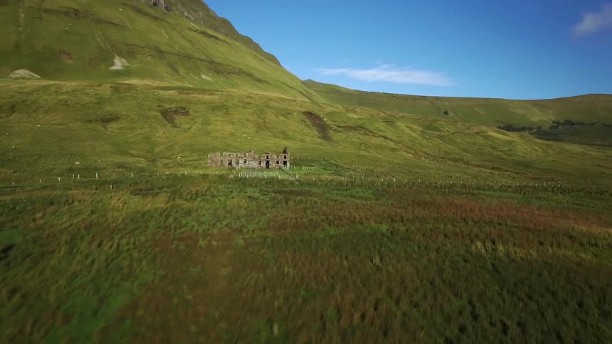 An abandoned building in a field