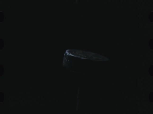 Hockey Puck in rotating motion
