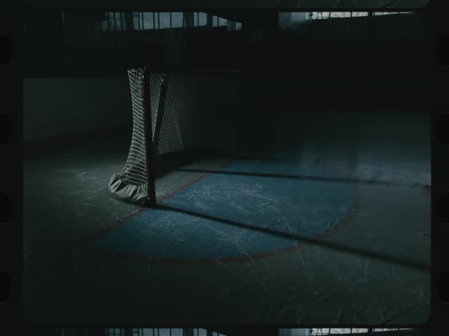 A hockey puck is slung into the net