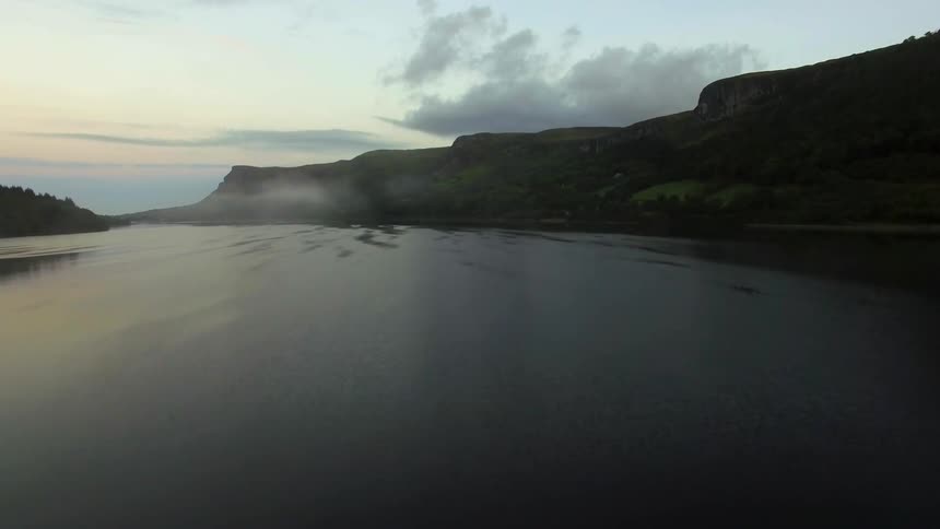 A lake near rocky cliffs