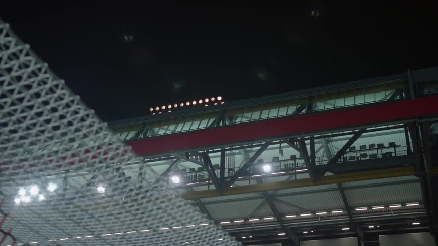 Lights come on over a stadium