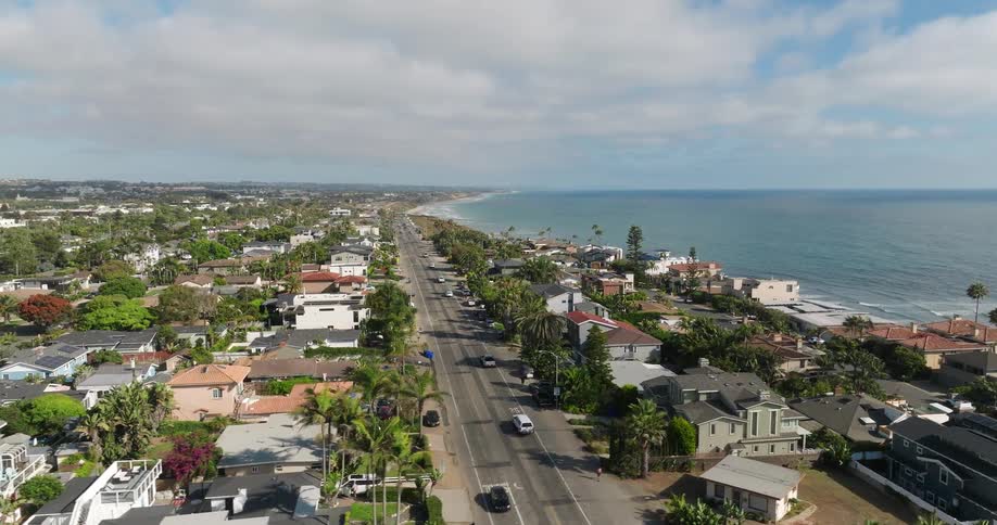 Aerial view of a coastal neighborhood with houses near the ocean