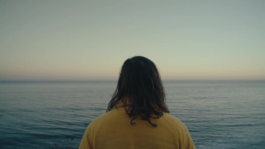 Man enjoying the ocean view at dawn