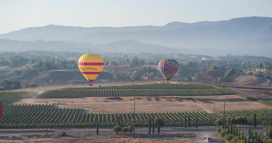 A few hot air balloons taking off